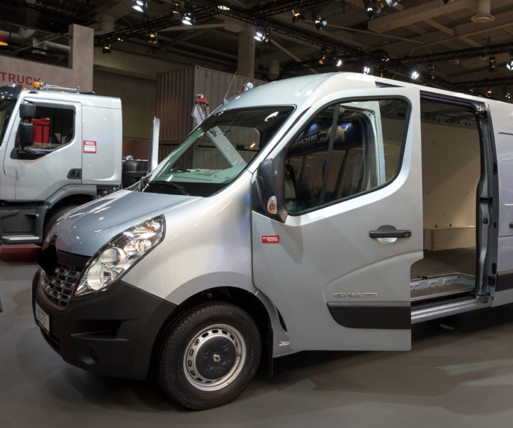 Silver Renault Master van with open doors at an expo.